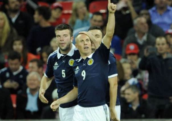 Kenny Miller celebrates his goal against England. Picture: Phil Wilkinson
