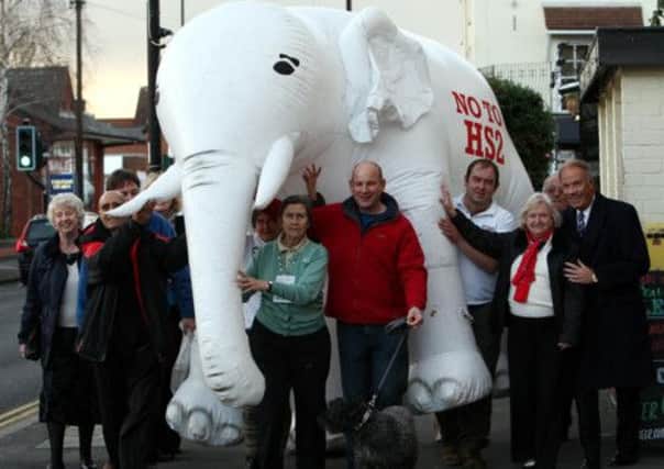 Members of the Stop HS2 campaign carry a white elephant to demonstrate their view of the rail link. Picture: PA
