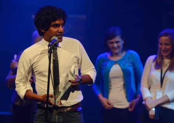 Rudi Dharmalingam, one of the stars of The Events, accepting the Carol Tambor Award. Picture: Neil Hanna