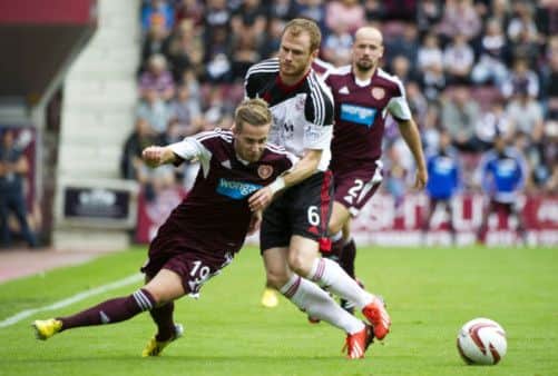 Billy King (left) is closed down by Aberdeen's Mark Reynolds. Picture: SNS