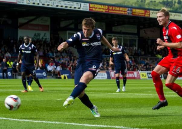 Ross County's Richard Brittain puts the ball into the net, putting his team 2-0 up. Picture: SNS