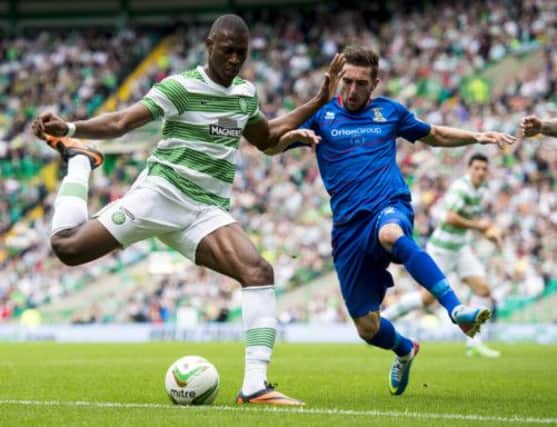 Amido Balde (left) is put under pressure by ICT's Grame Shinnie. Picture: SNS