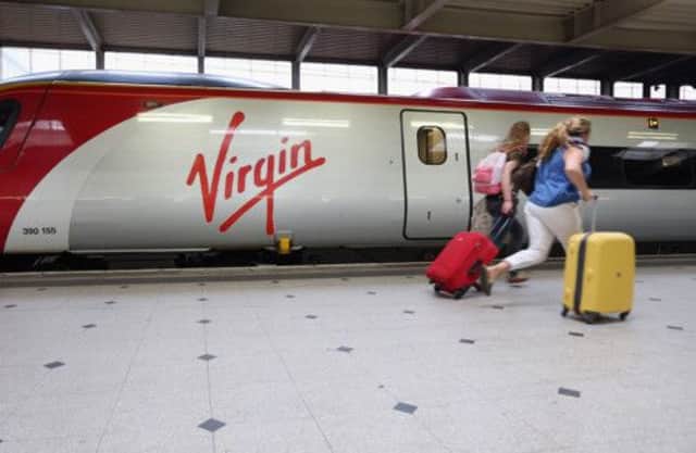 The reliability of Virgin Trains' services between Glasgow, Edinburgh and London is said to be getting so bad that business passengers who were lured on to rail by faster journeys are switching back to air. Picture: Getty