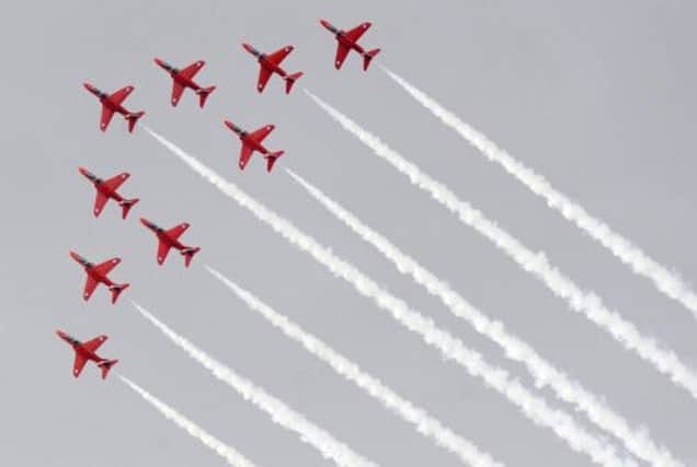 The Red Arrows perform a display over Edinburgh for Armed Forces Day 2011. Picture: Ian Rutherford