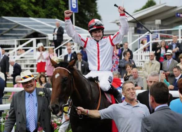 Tom Queally celebrates aboard Tiger Cliff after a thrilling victory in the Betfred Ebor at York on Saturday. Picture: PA