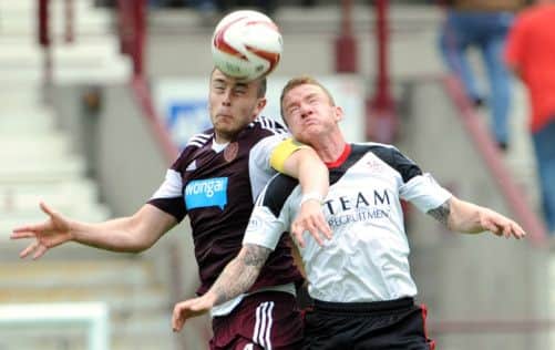 Danny Wilson tussles with Johnny Hayes of Aberdeen. Picture: Jane Barlow