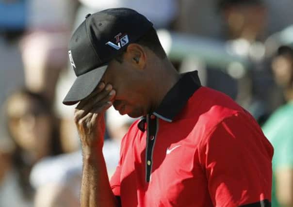 A back spasm hindered Tiger Woods title bid, but he still came close to forcing a play-off. Picture: Reuters