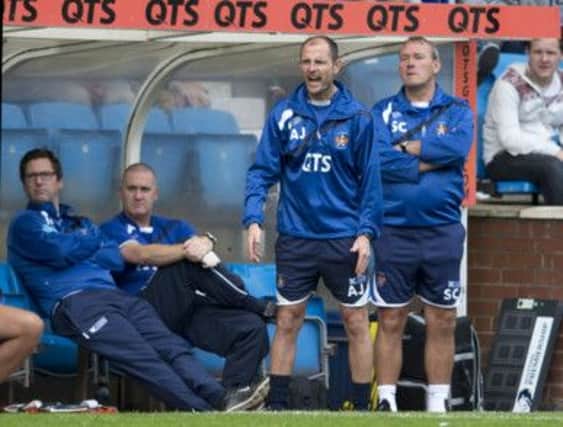 Kilmarnock manager Allan Johnstone urges his side on from the dugout. Picture: SNS
