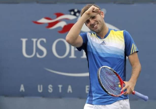 Dan Evans celebrates his straight sets victory over Kei Nishikori in New York yesterday. Picture:Reuters