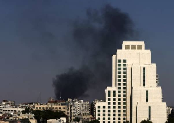 Smoke rise after heavy shelling in the Jobar neighborhood in Damascus, Syria. Picture: AP