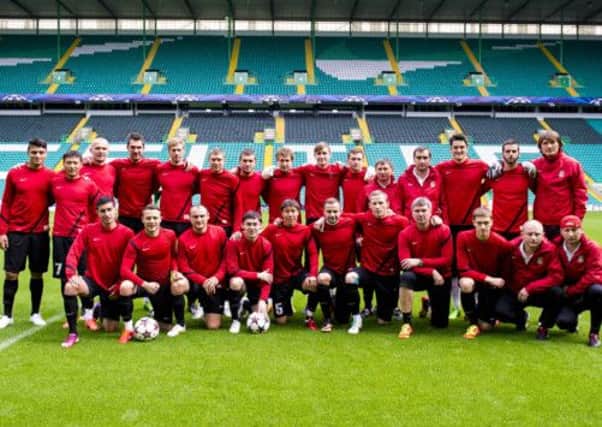 The Shakter Karagandy squad pose for a photo at Celtic Park. Picture: SNS