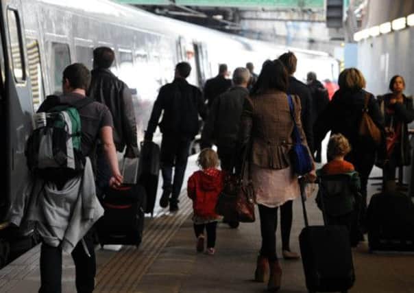Passengers disembark a train at Edinburgh's Waverley station. Picture: Ian Rutherford