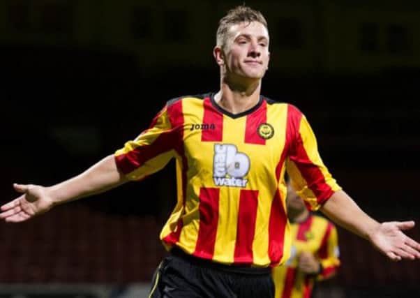 Aaron Muirhead wheels away to celebrate after giving Partick a 3-1 lead. Picture: SNS