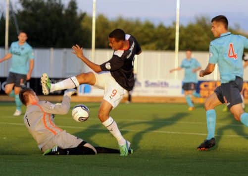 A tussle unfolds in the Dunfermline penalty box. Picture: Gary Hutchison