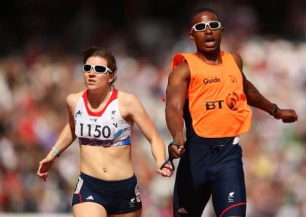 Libby Clegg and her guide Mikail Huggins in action at the London 2012 Paralympic Games. Picture: Getty