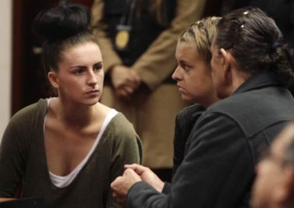 Michaella McCollum Connolly, left, and Melissa Reid speak to an interpreter during a hearing. Picture: AP
