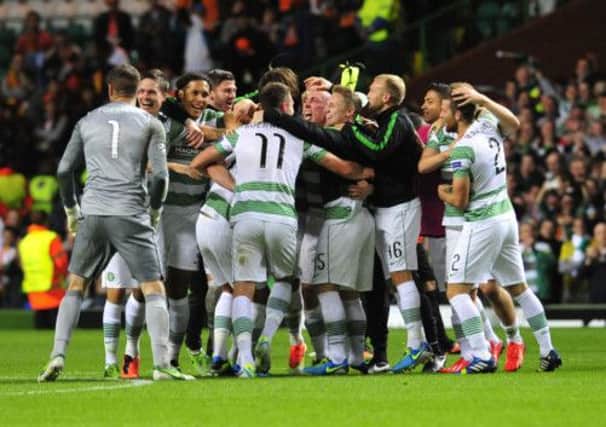 The Celtic squad celebrate their dramatic victory. Picture: Robert Perry