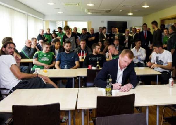 Neil Lennon and his squad watch the draw from the Celtics Lennoxtown canteen. Picture: SNS
