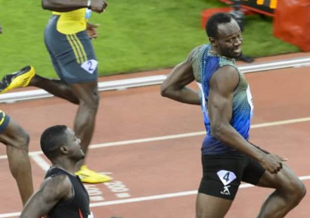 Usain Bolt edged past fellow Jamaican Nickel Ashmeade for the 100m victory last night. Picture: AP