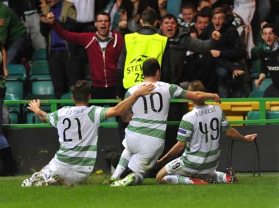 Celtic players celebrate James Forrest's winner. Picture: Robert Perry
