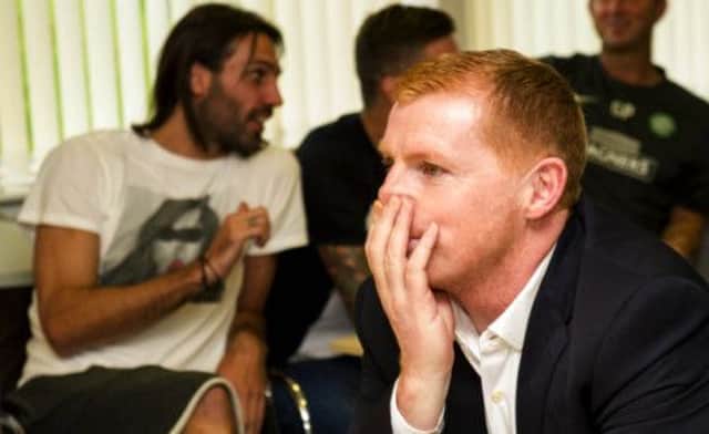 Neil Lennon feels the tension as the draw for the Champions League Group Stage is conducted. Picture: SNS