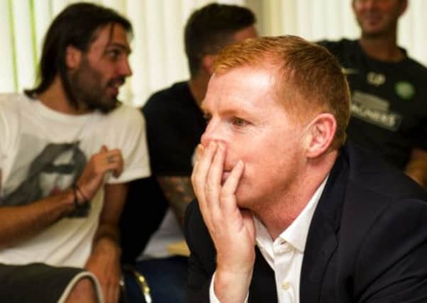 Celtic manager Neil Lennon watches the draw for the Champions League Group Stage unfold. Picture: SNS