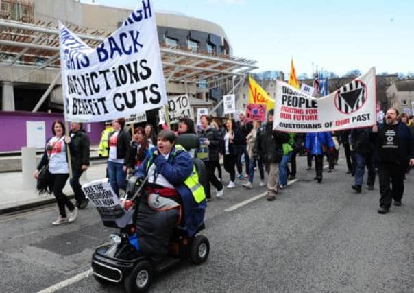 Protesters against the Bedroom Tax march by the Scottish Parliament. Picture: Ian Rutherford