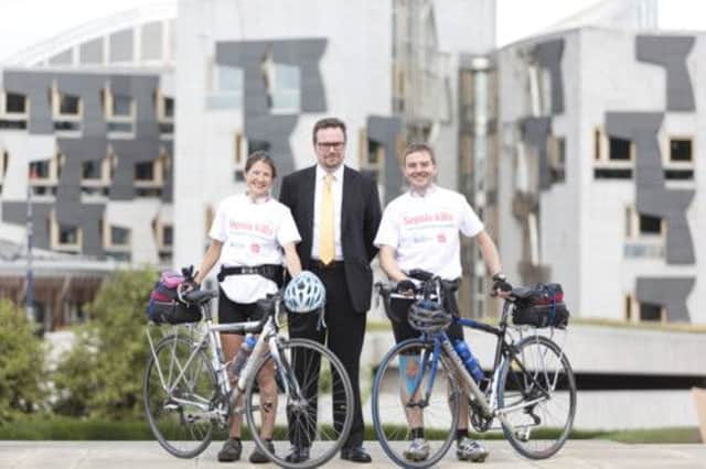 Craig Stobo with campaign cyclists Claire Gordon and Dan Beckett. Picture: Malcolm McCurrach