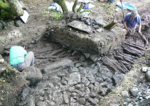 Archaeologists at the remains of an extensive iron age 'loch village' in Wigtownshire. Picture: PA