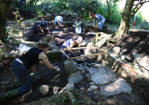 Archaeologists at the remains of an extensive iron age 'loch village' in Wigtownshire. Picture: PA
