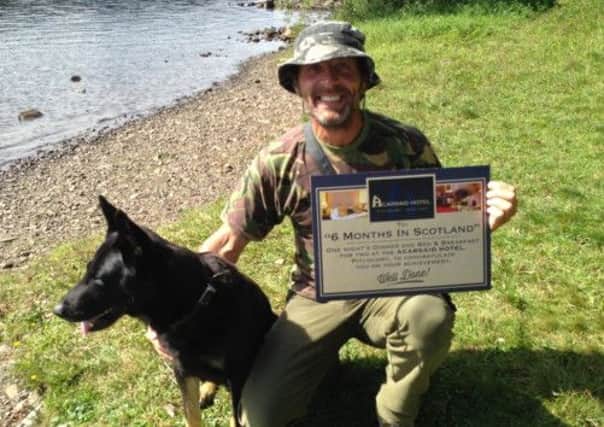 Wayne Hall with his dog Jerry celebrate completing their six month wild camp around Scotland. Picture: Wayne Hall
