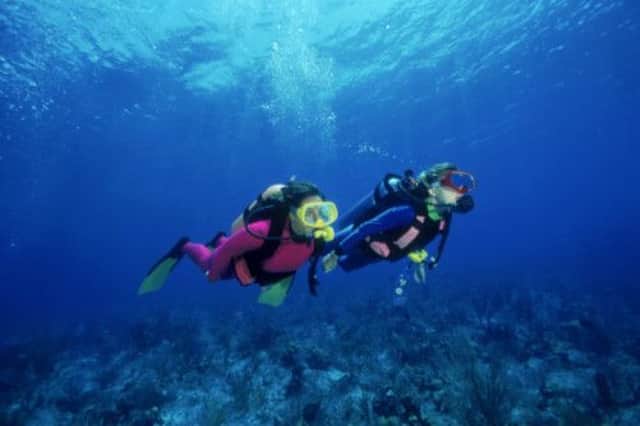 A team from St Andrews University discovered that young men are less willing to take part in physical challenges such as scuba diving. Picture: PA