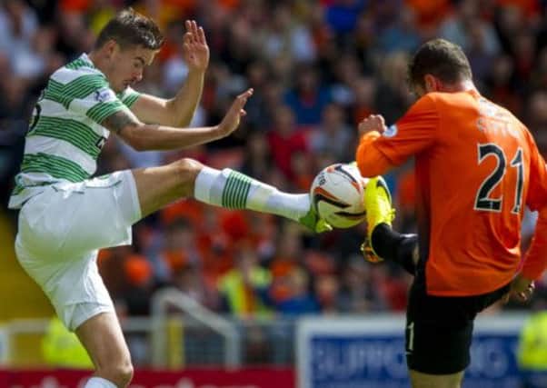 Celtic's Mikael Lustig clashes with Nadir Ciftci. Picture: SNS