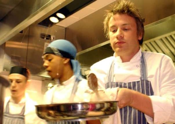 Jamie Oliver has demonstrated a commitment to improving the lives of those less fortunate than himself, such as in his restaurant Fifteen. Picture: PA