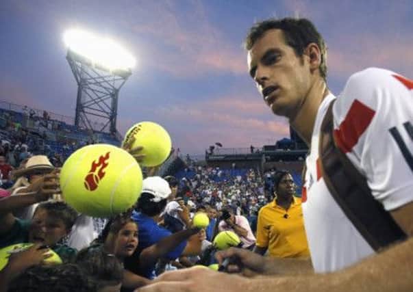 Andy Murray gave autographs to fans after Friday's win over Leonardo Mayer. Picture: Reuters