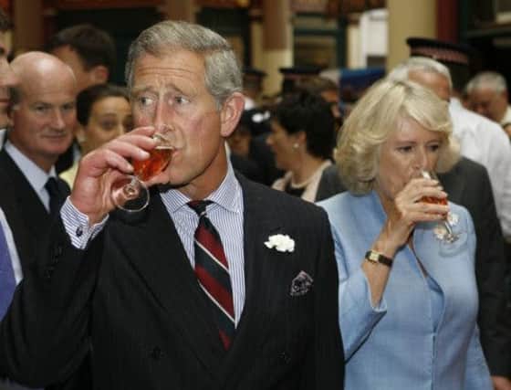 The Prince of Wales and the Duchess of Cornwall enjoy sparkling wine from the Camel Valley Estate Vineyard. Picture: PA