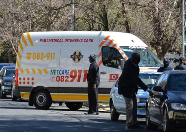 An ambulance carrying South Africa Nelson Mandela arrives at his house in Johannesburg. Picture: Getty