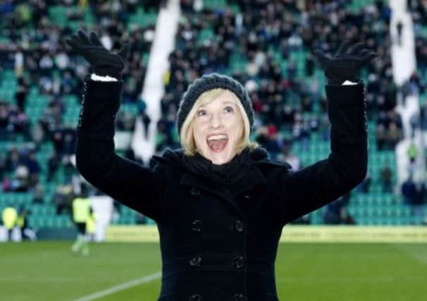 Actress Jane Horrocks takes to the pitch at half time at a Hibernian game in November 2012. Picture: SNS