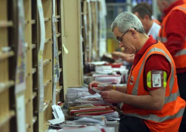 Workers at Edinburgh's Royal Mail Centre. Picture: PA
