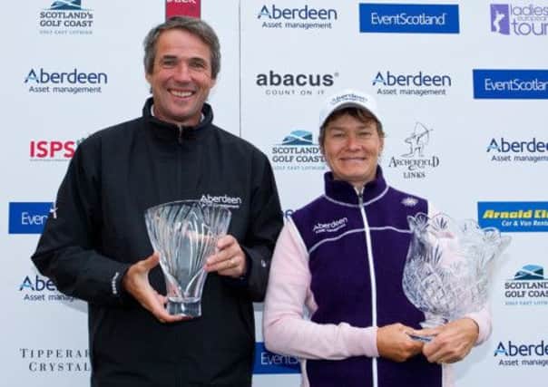 Catriona Matthew is presented with the trophy by broadcaster Alan Hansen. Picture: Contributed