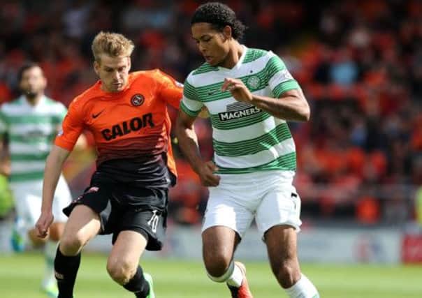 Celtic's Virgil Van Dijk challenges Dundee United's Stuart Armstrong during Saturday's game. Picture: PA