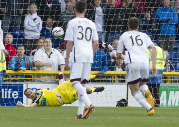 Hearts goalkeeper Jamie MacDonald saves Billy McKay's penalty. Picture: SNS