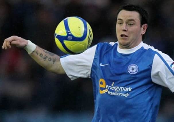 Peterborough's Lee Tomlin is reportedly keen on a move to Celtic. Picture: PA