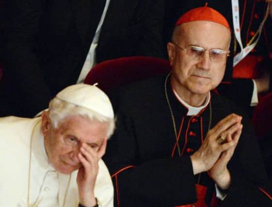 Cardinal Bertone says former Pope Benedict must share the blame for the scandals that have rocked the Vatican. Picture: AFP/Getty Images
