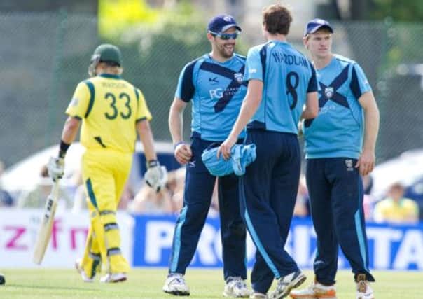 Scotland's Gordon Goudie (left) catches Shane Watson out from Iain Wardlaw's (8) ball but Australia won convincingly. Picture: SNS