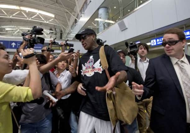 Dennis Rodman speaks to the media at Beijing airport. Picture: AP