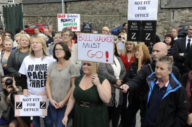 Demonstrators outside the Scottish Parliament calling for Bill Walker to resign. Picture: Julie Bull
