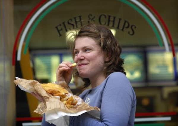 Australian Geraldine Gallagher enjoys a fish supper. Picture: Callum Bennetts