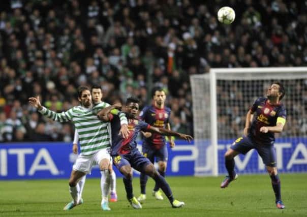 Alex Song and Xavi attempt to block Georgios Samaras during last season's match between Celtic and Barcelona. Picture: Robert Perry