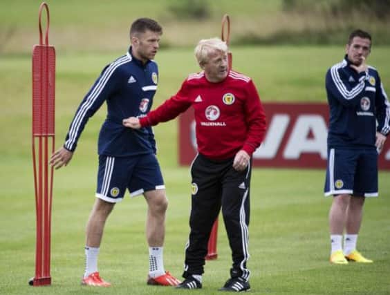 Scotland manager Gordon Strachan makes a point to Jamie Mackie during a Scotland squad training session yesterday. Picture: SNS